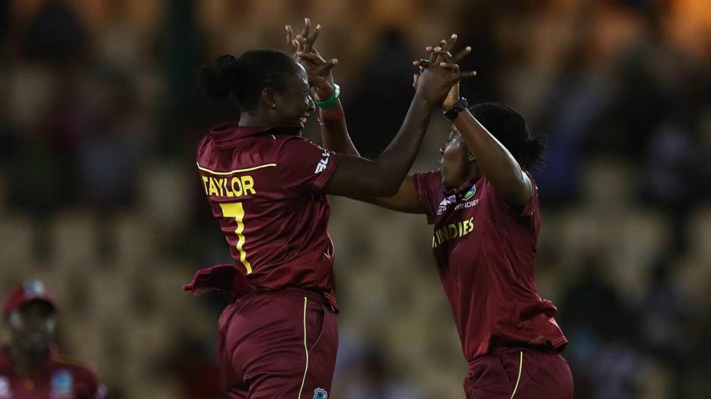 West Indies captain Stafanie Taylor (left) and teammate Shakera Selman celebrate a wicket against South Africa on Wednesday.