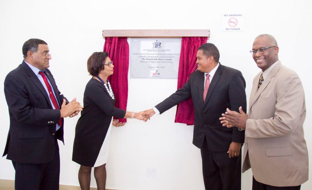 GRAND OPENING: Former Sports Minister Darryl Smith, second from right, shakes the hand of Toco/Sangre Grande MP Glenda Jennings-Smith, as Councillor Terry Rondon, left, and former Toco/Sangre Grande MP and Sport Minister Roger Boynes look on at the opening of the North Eastern Regional Multi-purpose Sport Facility in 2016.