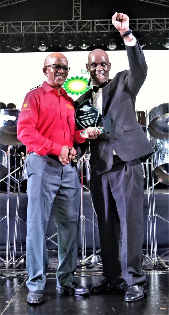Arranger Duvone Stewart is delighted to receive his award from Michael Marcano.