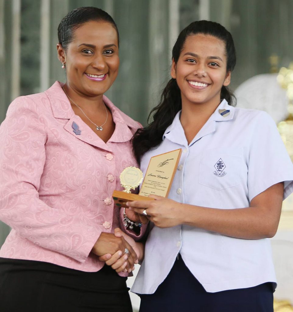 St Joseph Convent Awards function held on the School compound Port of Spain President of the past pupils association Laurel Lezama  presents the Convent pride award to Laura Ramphal PHOTOs BY AZLAN MOHAMMED