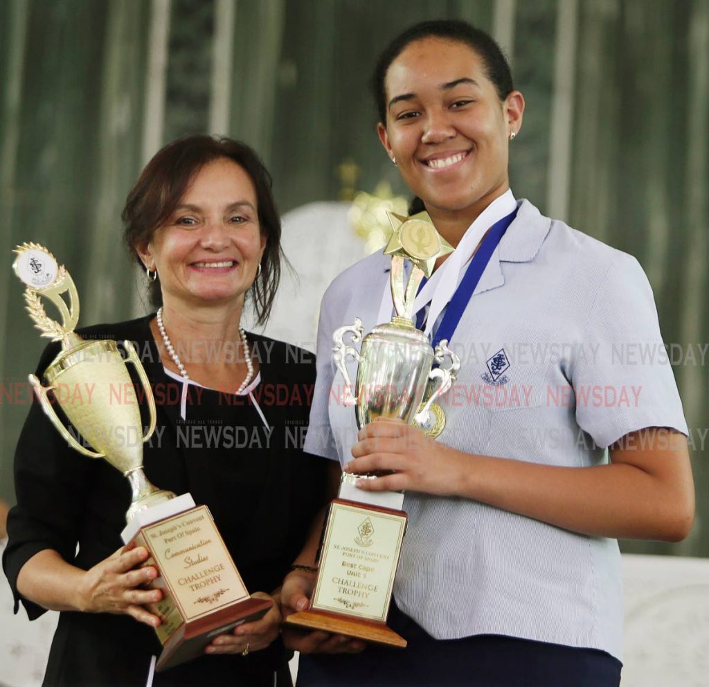 St Joseph Convent, Port of Spain Awards function
Principal Anna Pounder presents  trophies to Top CAPE unit one student Gabriella Low Chew Tung.

PHOTO BY AZLAN MOHAMMED