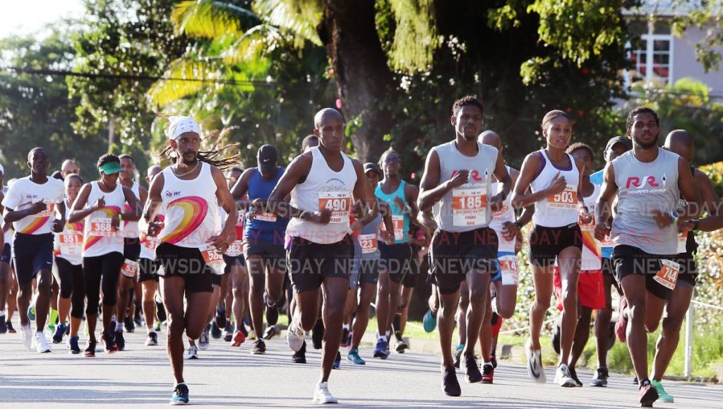 Runners take off in the Guardian Group SHINE Charity 5K and 10K yesterday at the Nelson Mandela Park, St Clair. 