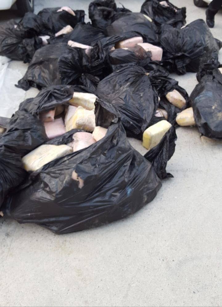 Garbage bags containing packets of marijuana found after a drug bust in Valsayn North yesterday morning. 
Police confirmed five men and four Venezuelan women were detained and are assisting police with investigations.  POLICE PHOTO