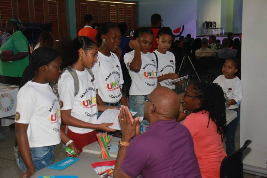 KNOWLEDGE: These young people were quite eager to get information about seeking out and being positive role models at a symposium held on Saturday at the Enterprise Government Primary School.