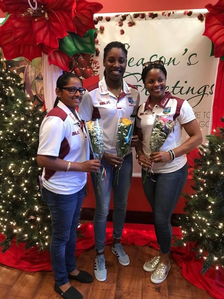 West Indies players (from left) Anisa Mohammed, Britney Cooper and Merissa Aguilleira at the VIP Lounge, Piarco International Airport, yesterday, after returning home from the ICC World T20 in Antigua. 
