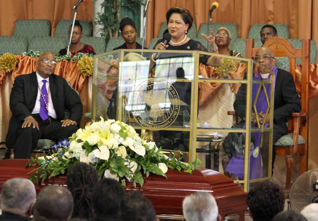 REST EAST: Opposition Leader Kamla Persad-Bissessar speaks at the funeral for former House Speaker Rupert Griffith at the Greater Malabar Christian Centre yesterday.