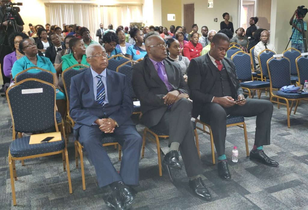 From left, front row, Education Minister Anthony Garcia sets with Chief Secretary Kevin Charles and Minister of State in the Ministry of Education Dr Lovell Francis at Tuesday’s national consultation on the Draft Education Policy Paper titled, “A Look into the Future,” at the Victor E Bruce Financial Complex in Scarborough.