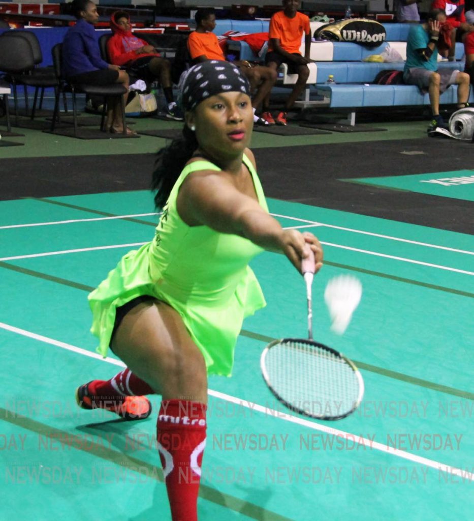 Nekeisha Blake retrieves the shuttle in a Group A women's singles match at the Solo National Badminton Tournament, held at the National Racquet Centre, Tacarigua. 