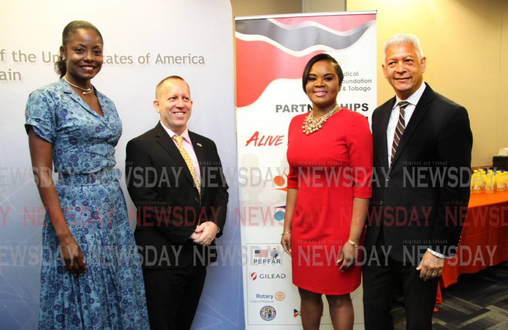 FROM LEFT  Hibiscus Foundation founder and former Miss Universe Wendy Fitzwilliam ,John McIntyre, US Embassy Charge D'Affairs, Shamfa Cudjoe, Minister of Sport and Youth Affairs  and the Mayor of Port of Spain Joel Martinez at the US Embassy Public Affairs office on Sweet Briar Road in St Clair during the function to mark World AIDS Day on Saturday, themed 'Alive and Well'  .PHOTO SUREASH CHOLAI.. ..EDITOR NOTE  US AMBASSADOR OUT COUNTRY, SO Mc INTYRE  REVERT TO OLD TITLE