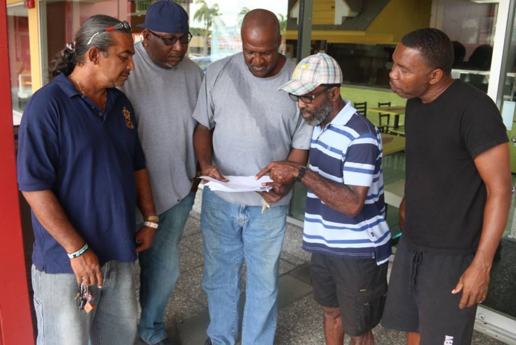 NOTHING FOR WE: From left, Nigel Jagessar, Robin Rose, David Austin, Dexter Applewhite and Roger Mitchell, all temps at Petrotrin who are set to be laid off with not a cent in compensation from the company. PHOTO BY ANSEL JEBODH