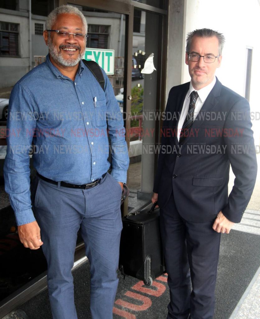 Afra Raymond (left) with his attorney Kingsley Walesby outside the San Fernando High Court yesterday PHOTO BY: ANSEL JEBODH 