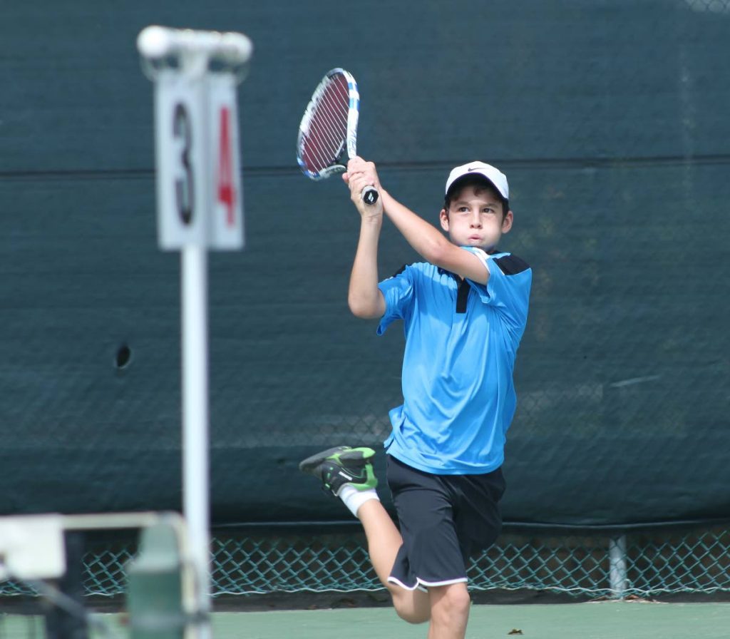 In this December 18, 2016 file photo, David Rodriguez plays a shot against Sebastian Sylvester in a Boys Under-14 match at the RBC Junior Tennis Tournament at the Trinidad Country Club, Maraval.
