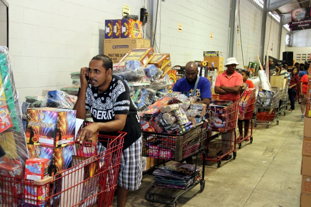 In this December 26, 2016 file photo customers line up to pay for fireworks at FireOne, Macoya. 