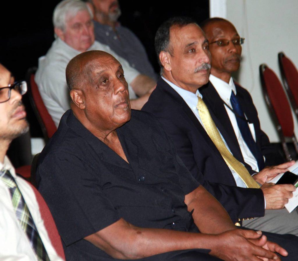  In this July 27 file photo, chairman of the UTT Board of Governors,  Professor Kenneth Julien, left, listens alongside UTT president Professor Sarim Al-Zubaidy to presentations at a seminar–The Transition to Utility Scale Renewable Energy Generation–at UTT's Point Lisas campus. PHOTO BY ANIL RAMPERSAD.