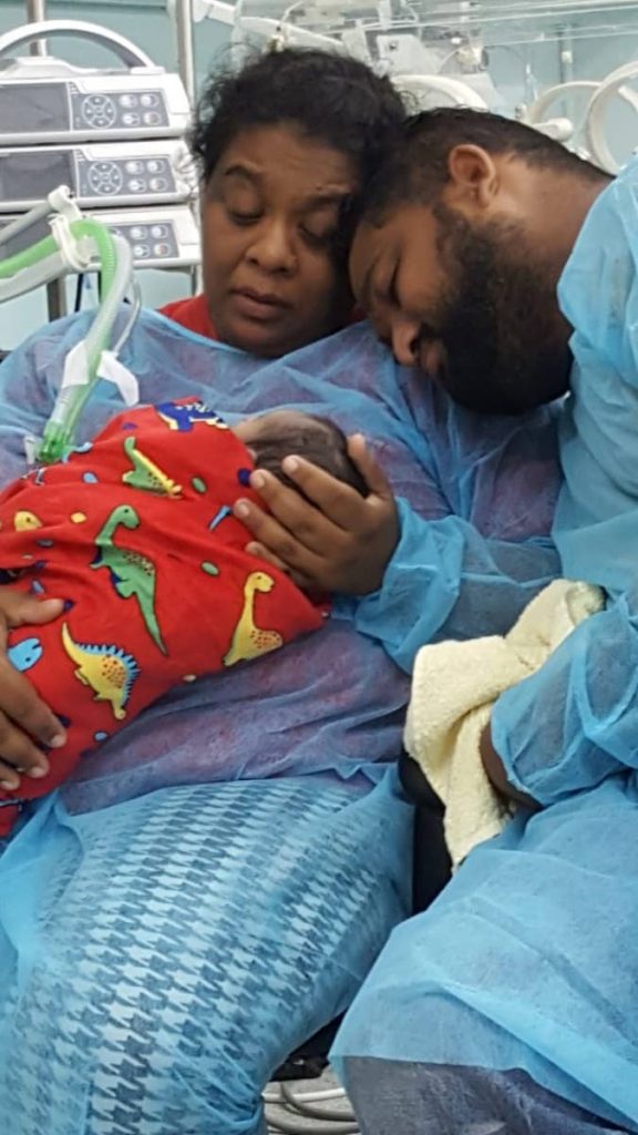 Savita Basdeo Lochan and Jerome Bernard hold their newborn son Jeremy Aiden Sylvester Bernard at San Fernando General Hospital. Jeremy was born on September 18 however he died on September 22.