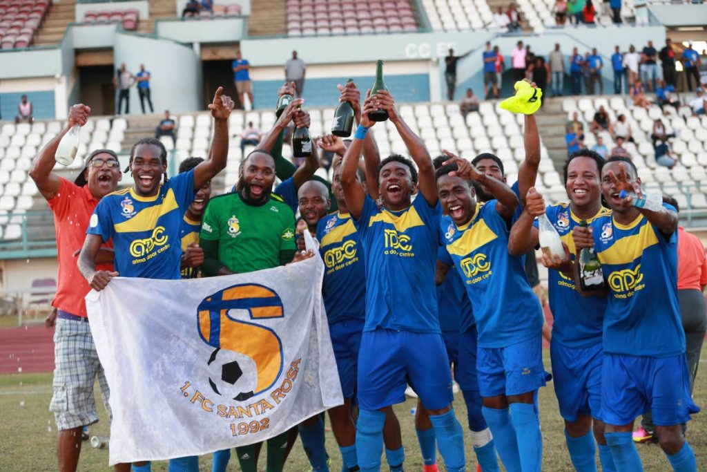 FC Santa Rosa players celebrate their 2018 TT Super League title at the Larry Gomes Stadium, Arima yesterday. Santa Rosa drew 1-1 with Cunupia FC to secure the crown.
