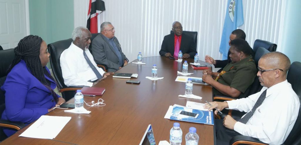 Ferry talks: Chief Secretary Kelvin Charles, centre, talks with representatives of the Port Authority of Trinidad and Tobago (PATT) at the Division of Education on Monday. From left are PATT’s acting Finance Manager, Nadine McKenzie, Terminal Manager Godfrey Redman, Board Commissioner Tommy Elias, Secretary of the Division of Infrastructure Kwesi Des Vignes, acting Administrator at the Division of Tourism Hazel Peterkin, and the Division’s Marketing Officer, Nigel Wilson.