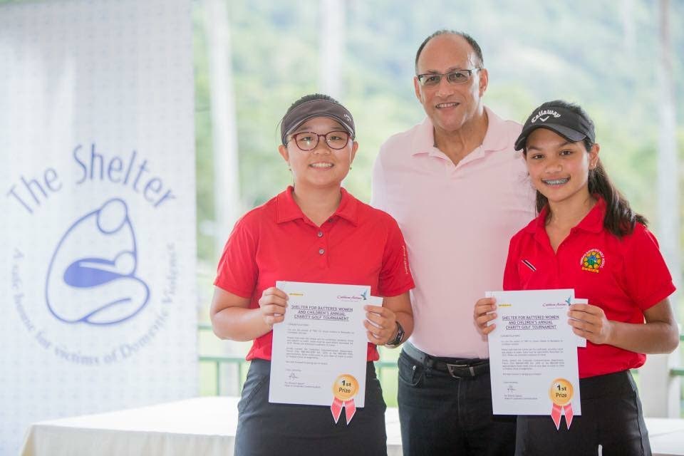 Scott Hamilton, centre, Chairman of The Shelter for Battered Women and Children, with Caylynn Hosein, right, and Ye Ji Lee, winners of The Shelter's annual golf charity tournament. 