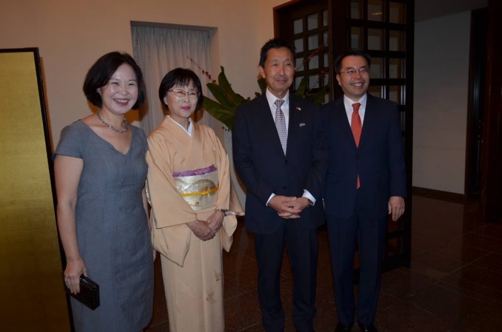Japanese Ambassador Mitsuhiko Okada and his wife Mari centre, welcome Korean Ambassador Sung Moon-up and his wife Cho Woohyun to the celebration