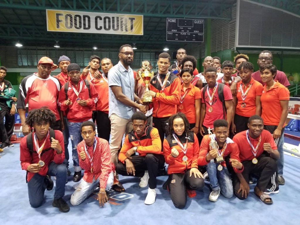 BIG HAUL: TT boxers with their trophy and medals in Guyana after winning 18 medals at the 2018 Caribbean Championships.