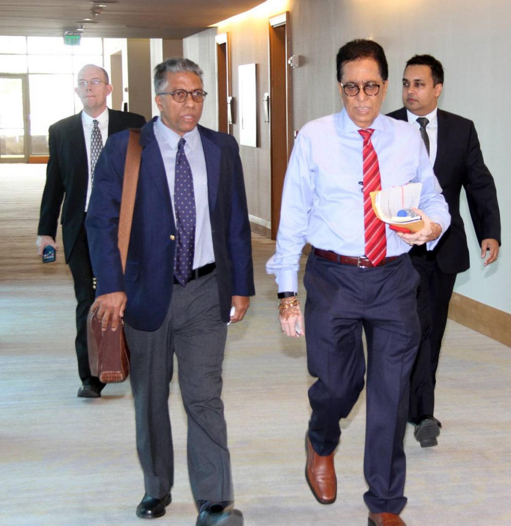 LEGAL HEAVYWEIGHTS: Senior Counsel Reginald Armour (left) and Seenath Jairam arrive at the Hyatt in Port of Spain today for the Law Association's special general meeting to consider a report on Chief Justice Ivor Archie.   PHOTO BY SUREASH CHOLAI