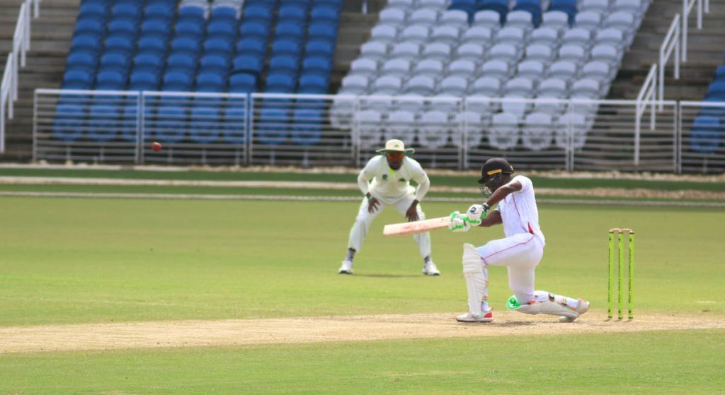 TT Red Force batsman Jason Mohammed plays a shot yesterday against the Windward Island Volcanoes, as play resumed on Day 2 of the Regional Four-Day clash at the Brian Lara Cricket Academy, Tarouba.