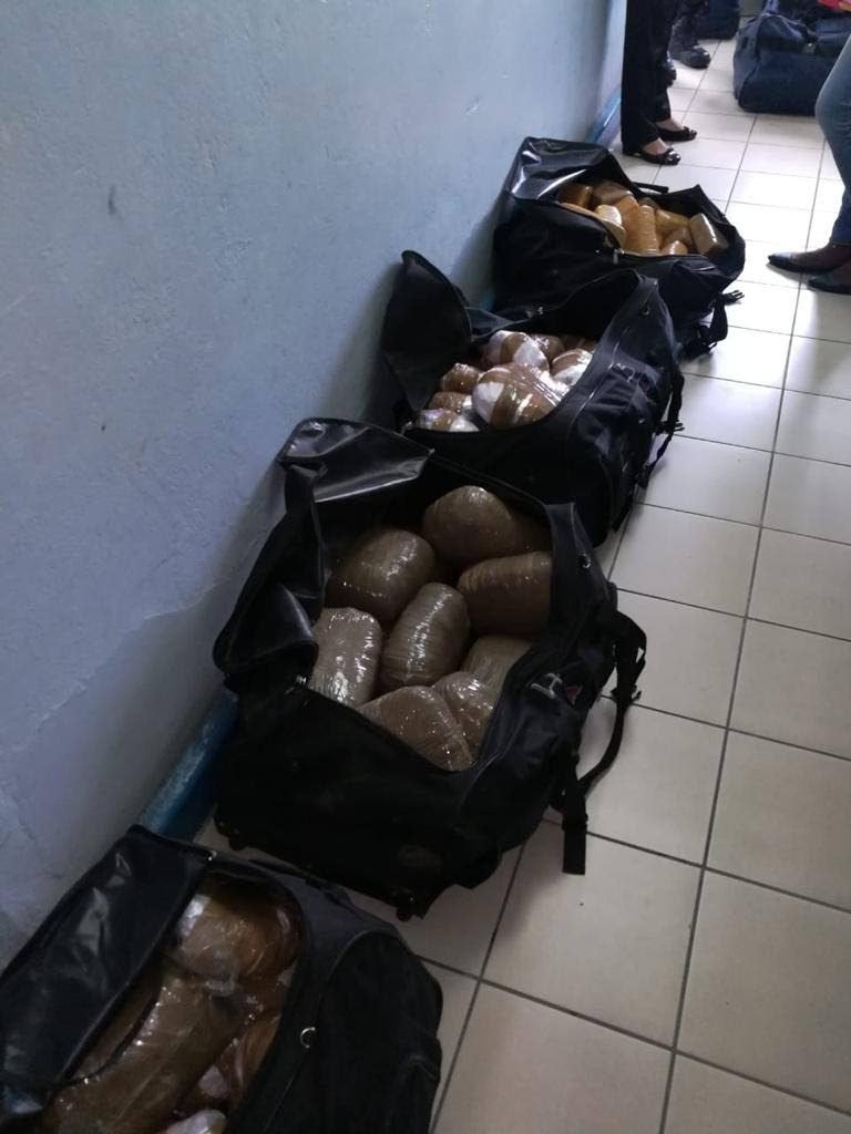 Bags containing compressed marijuana found in a shipment of beers at Caribbean Bottlers Co Ltd, Macoya, last Friday.