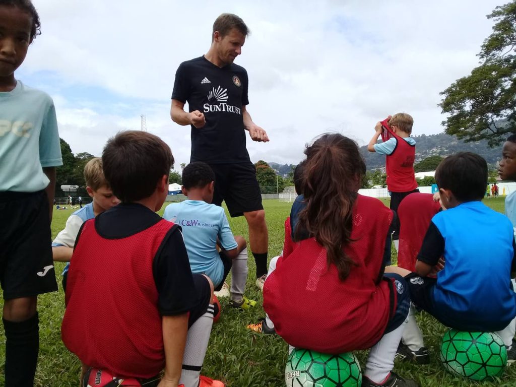 Atlanta United coach Matt Lawrey gives the youngsters a pep talk during the club’s camp, yesterday.
