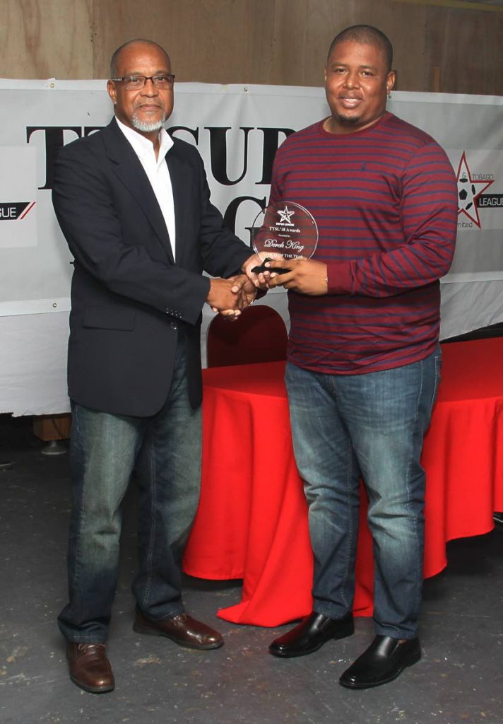 Derek King, right, collects the Coach of the Year prize from Super League president and FC Santa Rosa owner Keith Look Loy. 