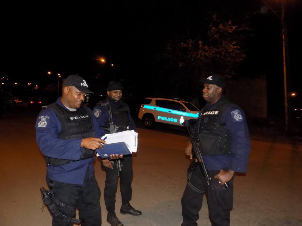 IATF officers during an exercise at Quarry Road, Success Village, Laventille on Friday night.