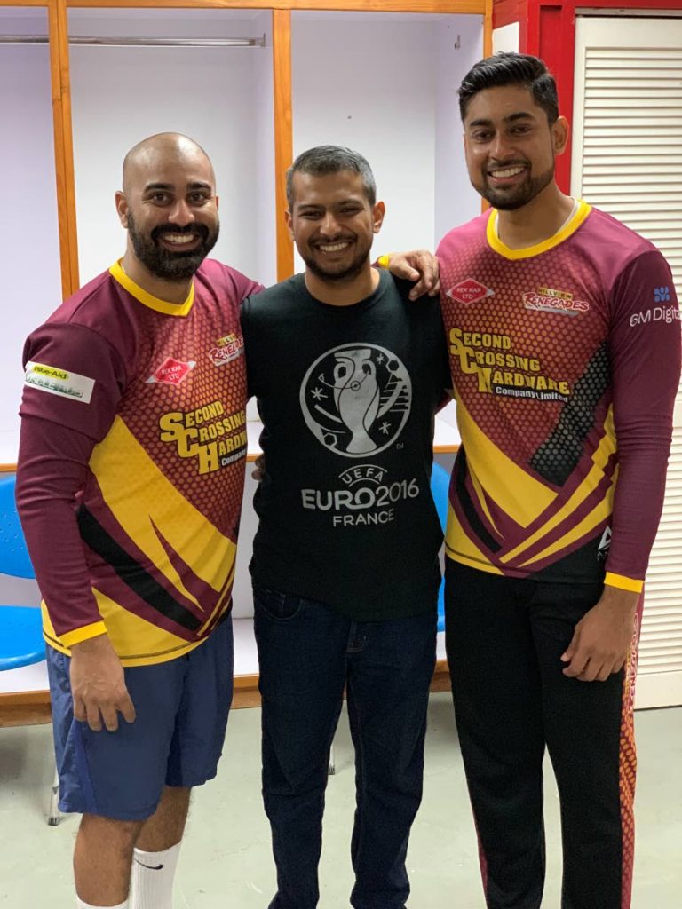 Rostan Mahabir, centre, with Kern Ramlochan, left, and Omkar Seetahal in the dressing room after a Hillview Renegades win at the Republic Bank Ross Cup, UWI-SPEC, St Augustine, last month.
