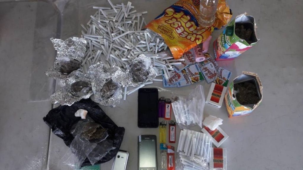 Cigarettes and marijuana found hidden in juice boxes and cheese snack packs on a prisons officer at Carrerra Island prison.