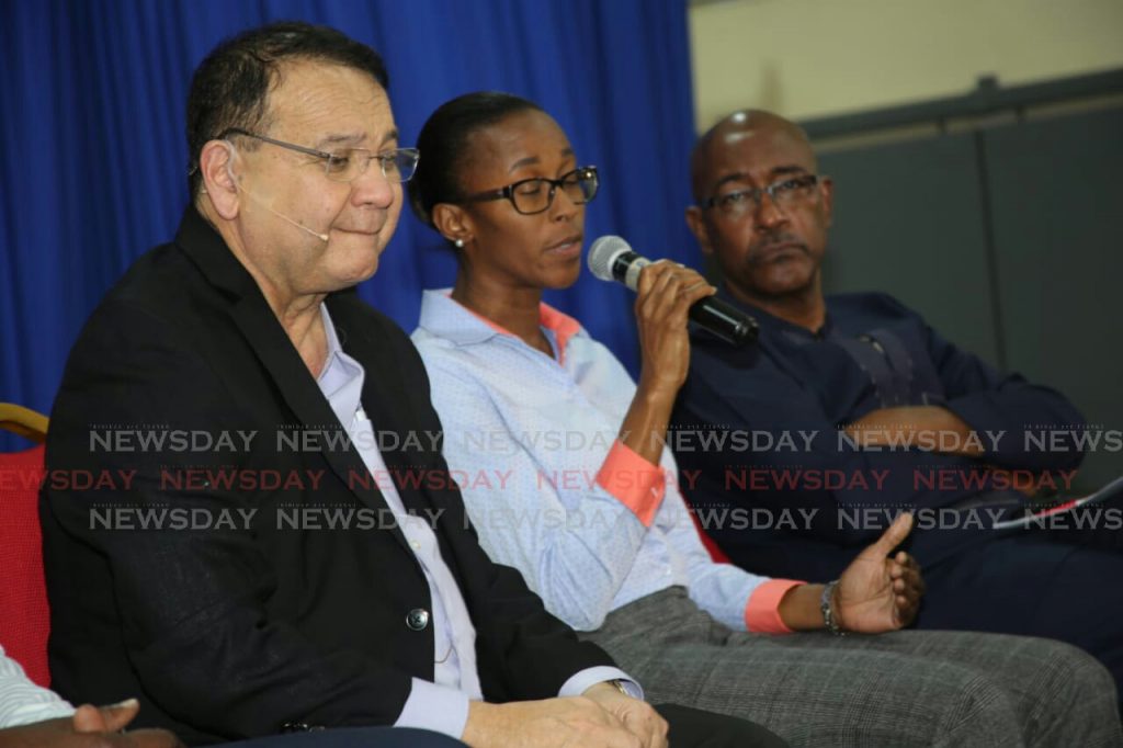La Brea MP Nicole Olivierre responds to a Palo Seco resident during Thursday night's Conversation with the Prime Minister. Energy Minister Franklin Khan (left) and Public Utilities Minister Robert Le Hunte look on. Photo by Vashti Singh