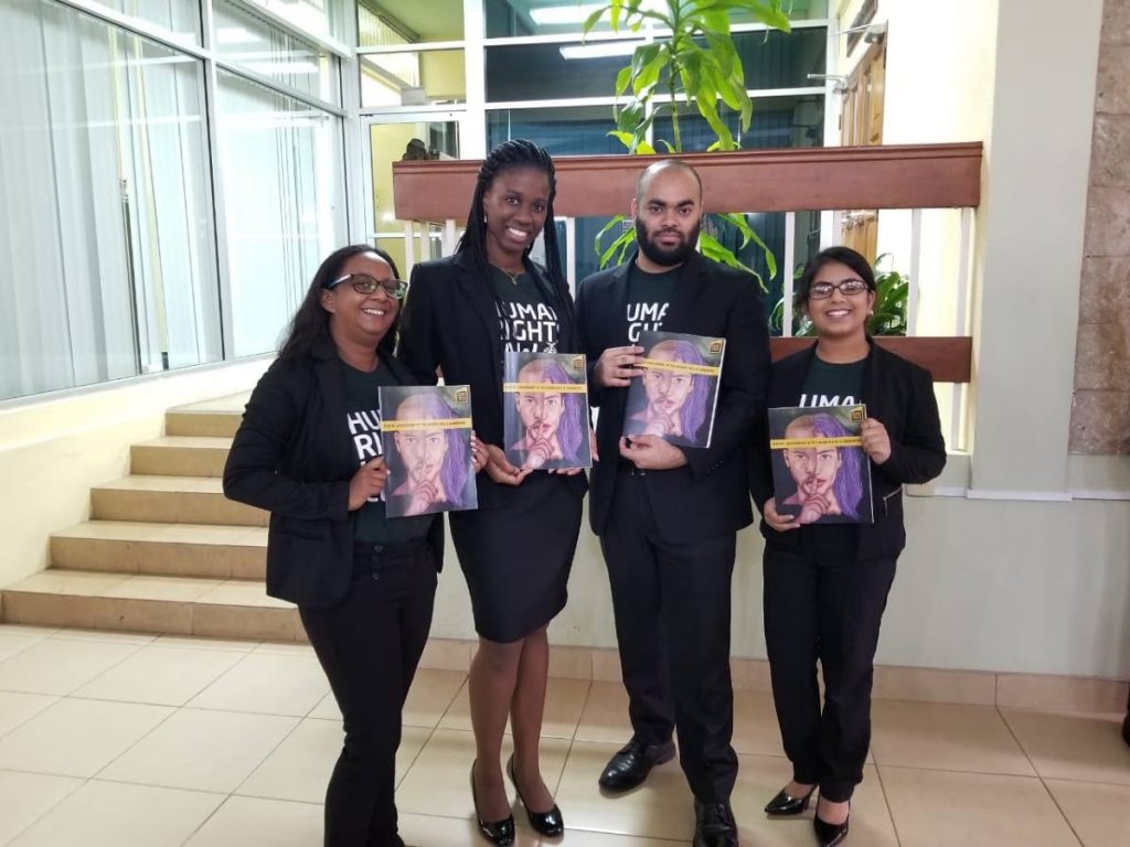 Hugh Wooding Law School year-two students  Sara 
Martinez, left, Rachel Weekes, Ansar 
Mohammed and Casiana Sankar pose with their 
Sexual Harassment 
Workbook.