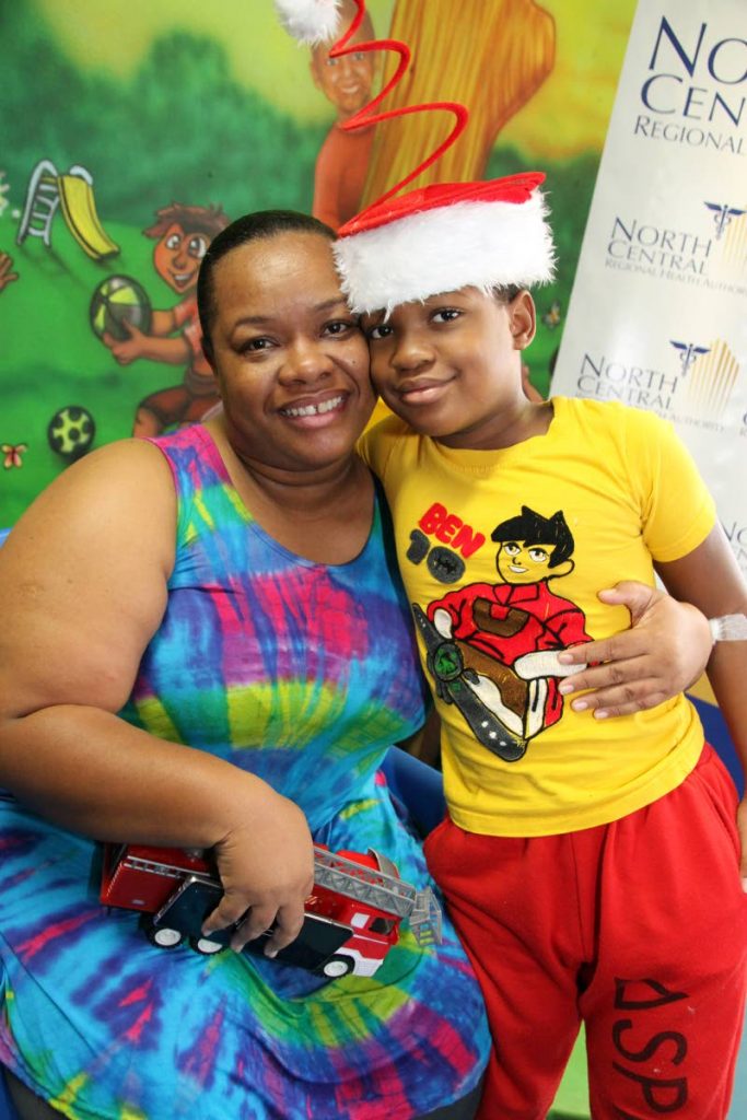 Keanu Alleyne, 10, hugs his mother  Laurel David at Wendy Fitzwilliam Paediatric Hospital, Eric Williams Medical Sciences, Complex Mt Hope on Boxing Day. Shortly before Christmas Keanu was diagonsed with Type 1 diabetes. Doctors advised with medication, a healthy diet and regular exercise Keanu would live a healthy life. PHOTO SUREASH CHOLAI