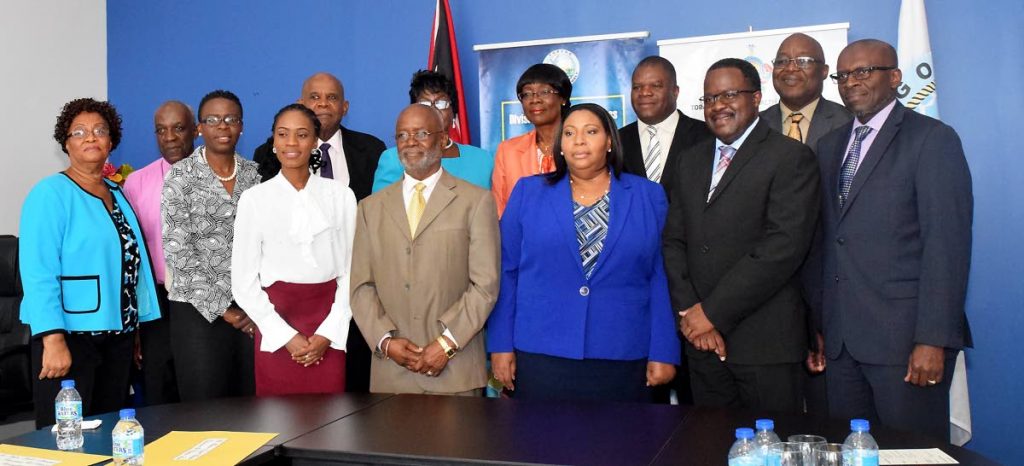 Members of the Board of the Tobago Regional Health Authority pose for a photo with Chief Secretary Kelvin Charles, second from right, back row, and Health Secretary Dr Agatha Carrington, fourth from right, back row, at a retreat at the Division of Health in July last year. At left is Ashworth Learmont is then Chief Executive Officer who resigned in August following his June appointment, and Ingrid Melville, Chairman, second from left.