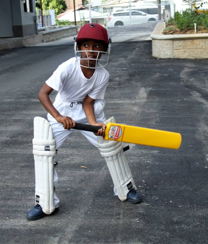 Jeremiah Baird sets his position to strike against a ball.