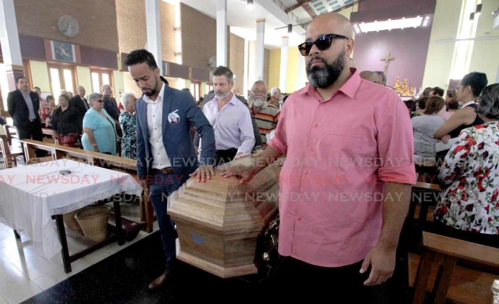 Kees Dieffenthaller leads the casket alongside his brother Hans, and other relatives,
 the funeral service for the late George Bunny Dieffenthaller, St Finbar's RC Church, Diego Martin. PHOTO BY ROGER JACOB   