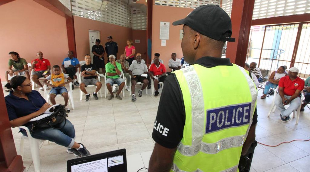Sgt Orcil Phillip, of Cumuto Highway Patrol, speaks about road safety and measures cyclists can adopt to protect themselves during a forum hosted by Madonna Wheelers at Arima Velodrome, Arima yesterday. PHOTOS BY ROGER JACOB