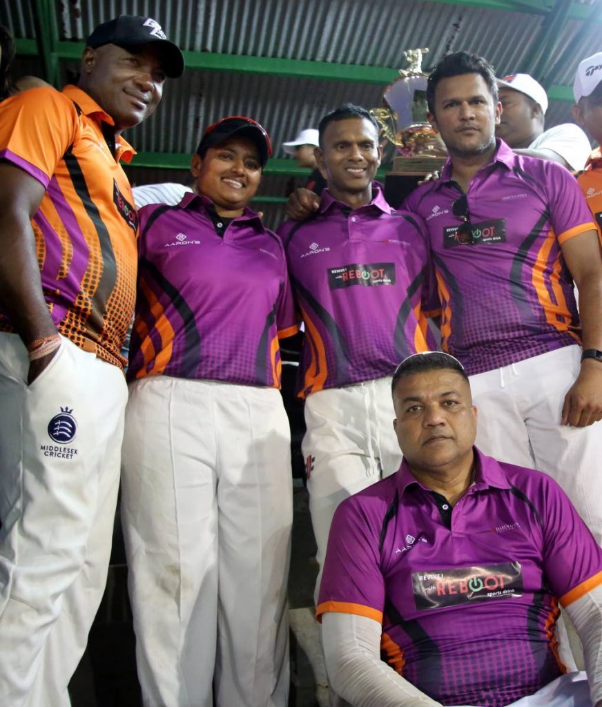 STARS ALIGN: Windies legend Brian Lara, left, WI spinner Anisa Mohammed, second from left, Guyanese icon Shivnarine Chanderpaul, second from right, and ex-TT captain Daren Ganga with Ganga XI wicketkeeper Faizl Jahoor, seated, at the Daren Ganga Recreation Ground in Barrackpore on Saturday.