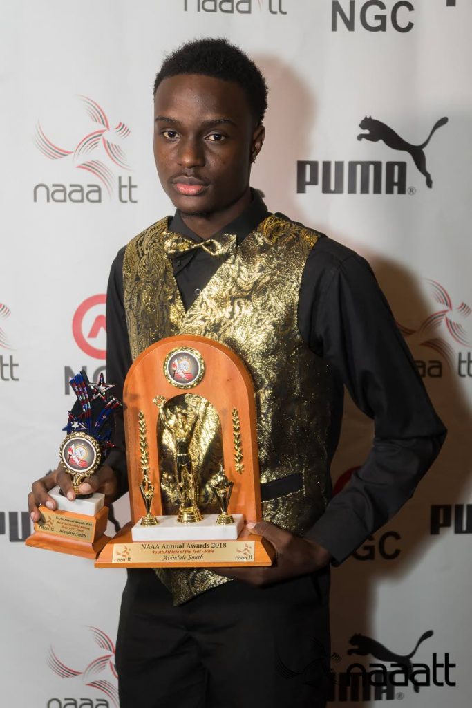Youth Athlete of the Year Avindale Smith has his hands full at the NAAA awards ceremony on Saturday.