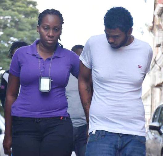 Jerod Boysie was escorted to the San Fenrando High Court yesterday charged with  the rape and kidnapping of two women PHOTO BY: ANSEL JEBODH
