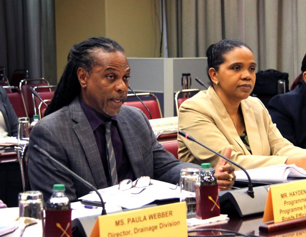Ministry of Works director Hayden Phillip and permanent secretary Sonia Francis-Yearwood testify before Parliament’s Public Administration and Appropriation Committee yesterday. PHOTO SUREASH CHOLAI
