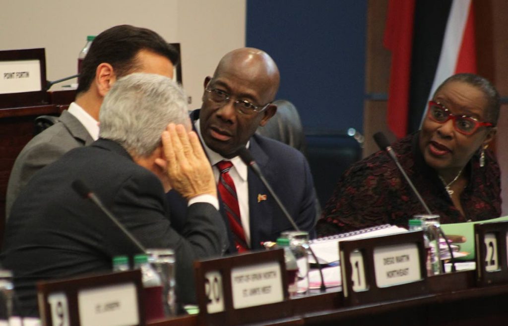 Prime Minister Dr Keith Rowley and Chief Whip and Minister of Planning and Development Camille Robinson-Regis focus their attention towards Finance Minister Colm Imbert alongside Attorney General Faris Al-Rawi at yesterday’s sitting of the Lower House of Parliament in Port of Spain. PHOTO BY ROGER JACOB.