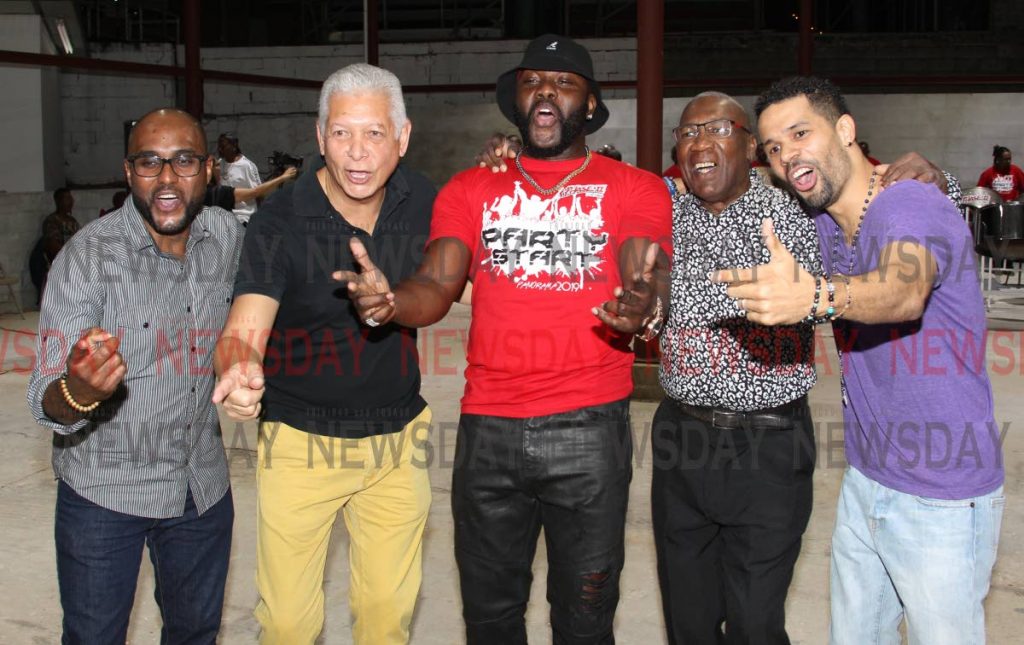 File photo: Port of Spain Mayor Joel Martinez, second from left, and Phase II arranger Len 