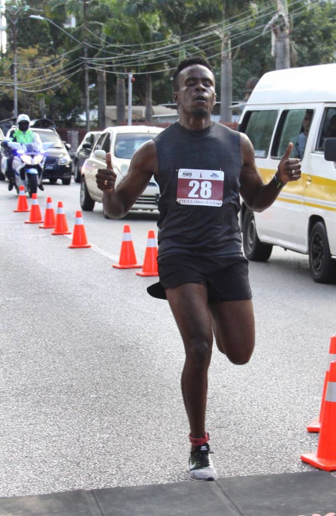 Cy Sarjeant crosses the finish line yesterday to win the TTUTA Teacher’s one-lap event, at the Queen’s Park Savannah, Port of Spain.

Phot: Angello Marcelle