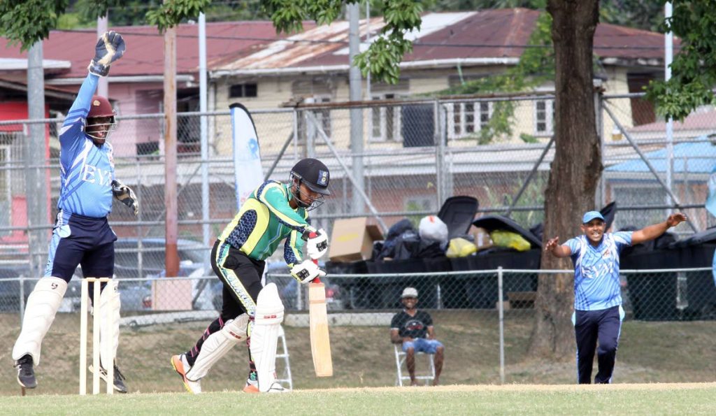 EL Socorro Youth Movement players make a successful appeal for LBW against Clarke Road’s Nicholas Sookdeosingh, in their UWI-Unicom T20 match, at the Sir Frank Worrell Ground, yesterday.