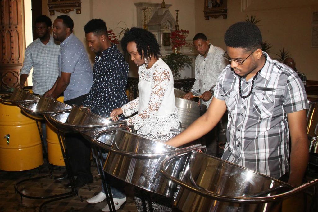 CHURCH PAN: Members of Trinidad All Stars Steel Orchestra play during their thanksgiving service yesterday at the Holy Rosary Church in Port of Spain. PHOTO BY ANGELO MARCELLE