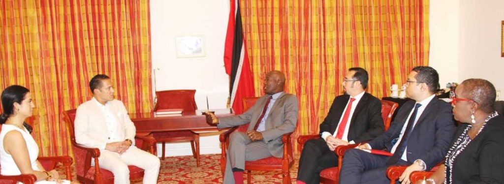 Prime Minister Dr Keith Rowley, third from left, chats with officials from the Sunwing Travel Group at the Diplomatic Centre in St Anns last week Wednesday. Also present at the meeting were, from right, Minister of Planning and Development Camille Robinson-Regis on Minister of National Security, Minister of Tourism Randall Mitchell and Communications Minister Stuart Young. 