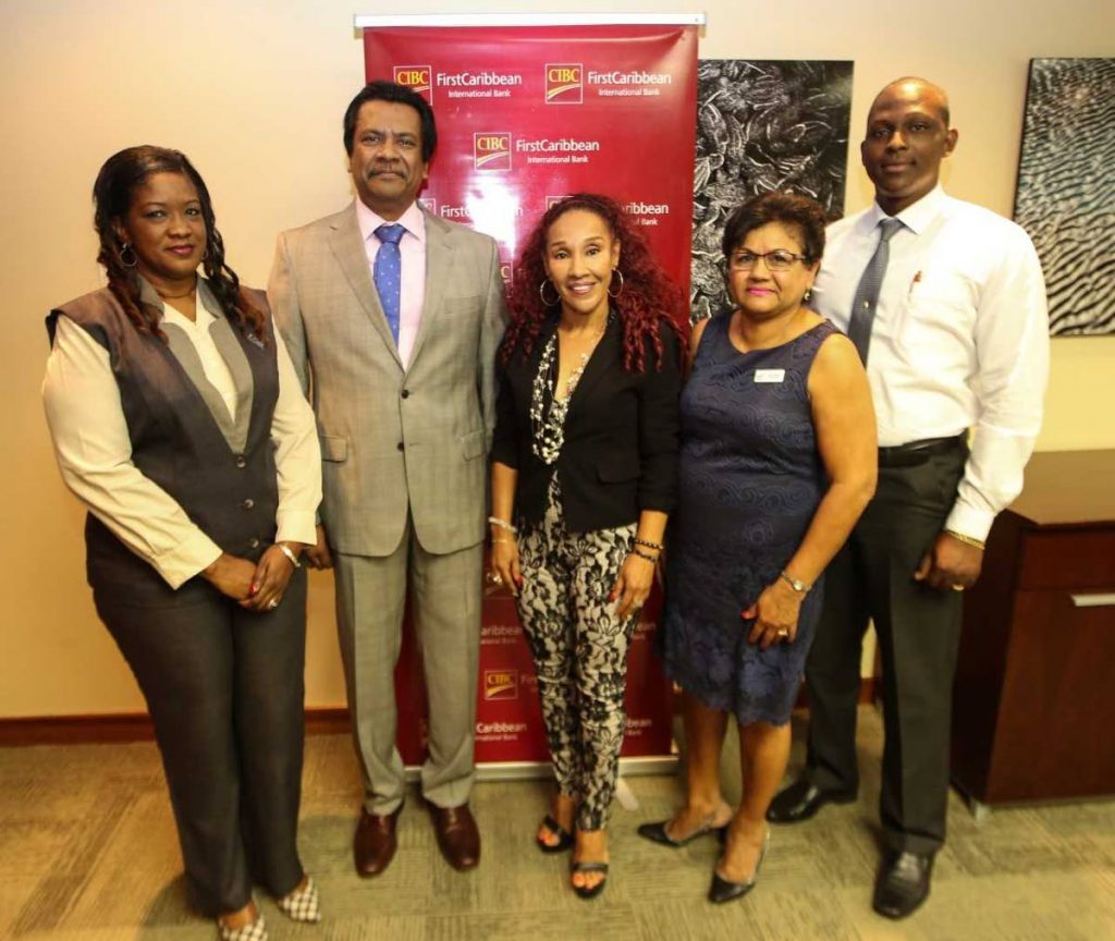 Managing director of CIBC FirstCaribbean Trinidad Operations, Anthony Seeraj, second left,  with   Sherma Mills-Serrette, left, clinic manager of the TTCancer Society  ; entertainer Marcia Miranda representing her charity Children with Cancer Support Group; Lilia Mootoo, general manager of Vitas House; and Kevin Cox, general manager of the Cancer Society.